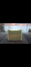 Bar of soap on a wooden surface with a blurred background